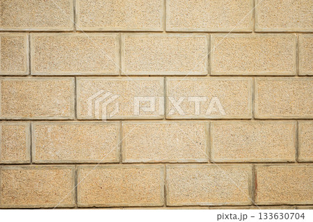 Textured beige brick wall pattern with horizontal staggered layout Textured beige brick wall pattern with horizontal staggered layout 133630704