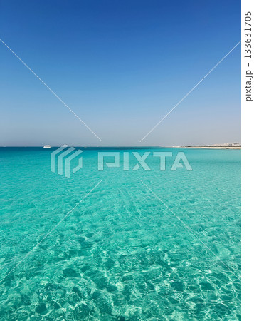 Clear turquoise ocean under bright blue sky Clear turquoise ocean under bright blue sky 133631705