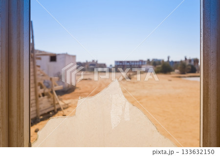 Broken window with desert landscape view Broken window with desert landscape view 133632150