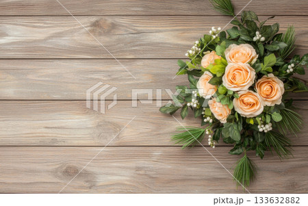 Peach rose bouquet wooden background green foliage white berries horizontal layout natural light 133632882