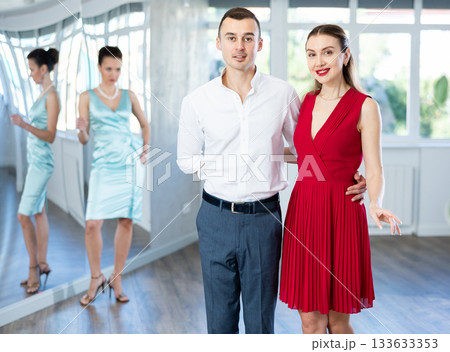 Couple in formal wear rehearsing wedding waltz in dance studio 133633353