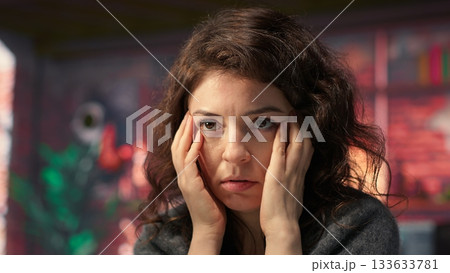 Businesswoman in a modern workplace types on a keyboard next to chroma key, using a creative agency office setup for digital media work. High tech workstation perfect for tasks. Camera A. 133633781