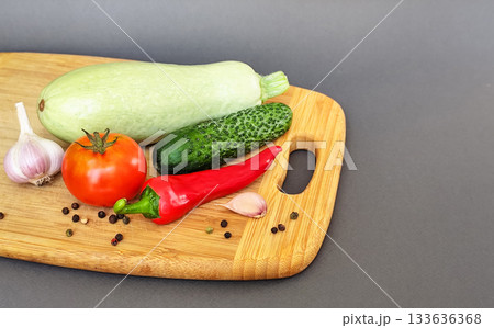 Composition of fresh vegetables on a wooden surface Composition of fresh vegetables on a wooden surface 133636368
