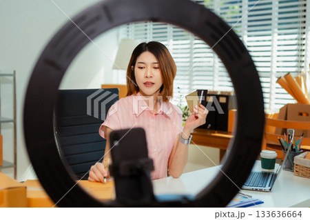 Small business entrepreneur SME freelance woman working at home office, boxs ,tablet and laptop online, marketing, packaging, delivery, e-commerce concept. Small business entrepreneur SME freelance woman working at home office, boxs ,tablet and laptop online, marketing, packaging, delivery, e-commerce concept. 133636664