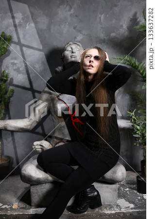 Legendary female figure amid weathered leaves and textures Legendary female figure amid weathered leaves and textures 133637282
