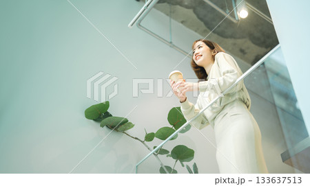 Adult asian business woman relax drinking coffee at indoors cafe Adult asian business woman relax drinking coffee at indoors cafe 133637513