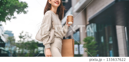 Single adult business asian woman holding coffee cup and shopping bag city people lifestyle Single adult business asian woman holding coffee cup and shopping bag city people lifestyle 133637622