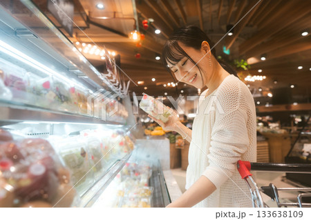 Young adult asian woman consumer choosing organic asia fruits product at supermarket store Young adult asian woman consumer choosing organic asia fruits product at supermarket store 133638109