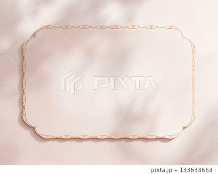 Blank Vintage Paper Card Mockup with Elegant Gold Border, Aesthetic Sunlight Shadows on Beige Texture Background, Copy Space for Wedding Invitation or Menu Design. 133638688