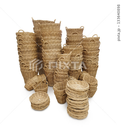Handmade woven basket, straw goods, textiles on white background. Handmade woven basket, straw goods, textiles on white background. 133640898