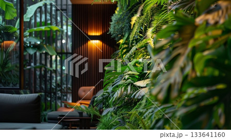 Lush greenery adorns the walls and brings a touch of nature inside the lobby 133641160