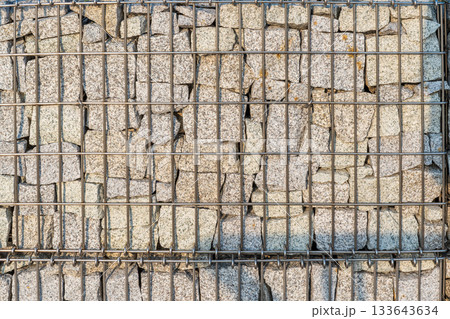 Modern Gabion Wall From Rocks And Stones In Metal Wire Box. Reinforcement and Abutment Protective Construction 133643634