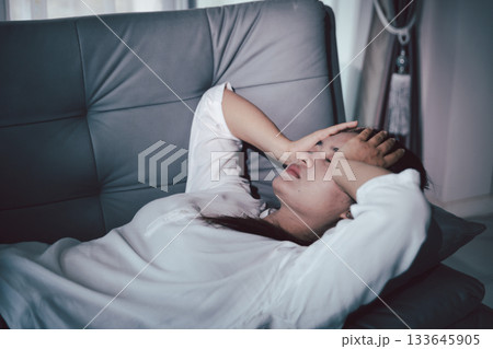 Sorrowful woman sat alone, overwhelmed by emotion, her sad and unhappy expression revealing deep despair, stress and distress left feeling depressed. sorrowful sad, despair alone, depressed stress Sorrowful woman sat alone, overwhelmed by emotion, her sad and unhappy expression revealing deep despair, stress and distress left feeling depressed. sorrowful sad, despair alone, depressed stress 133645905