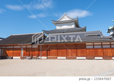 Nagoya castle, Nagoya, Aichi, Japan, Traditional Japanese castle building with wooden walls under blue sky Nagoya castle, Nagoya, Aichi, Japan, Traditional Japanese castle building with wooden walls under blue sky 133647087