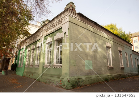 Historical green building on a quiet street in autumn Historical green building on a quiet street in autumn 133647655