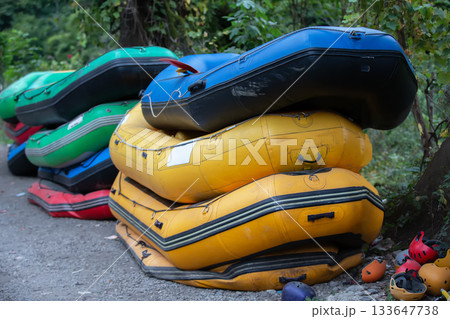 Rubber boats and helmets for rafting. Active recreation during travel Rubber boats and helmets for rafting. Active recreation during travel 133647738