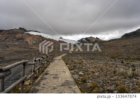 Stone trail leading to Pastoruri Glacier, Huaraz, Peru, amidst rugged mountains Stone trail leading to Pastoruri Glacier, Huaraz, Peru, amidst rugged mountains 133647874