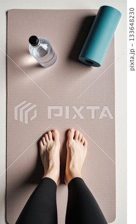 Post Workout Recovery Flat Lay with Bare Feet on Mat 133648230