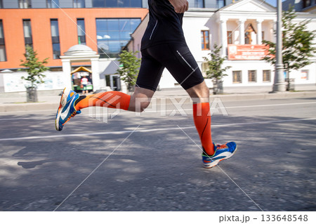 Man running marathon 133648548