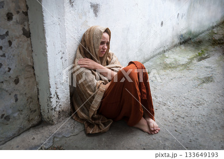 Frozen girl sitting on the floor 133649193