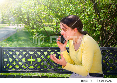 Young girl speaking by phone 133649201