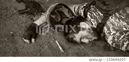 Wounded soldier laying on the ground Wounded soldier laying on the ground 133649207