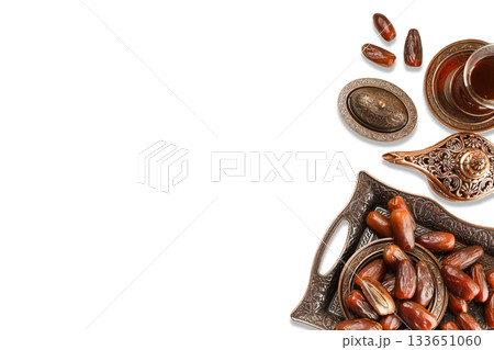 Sweet dates arranged with tea for Ramadan celebration Sweet dates arranged with tea for Ramadan celebration 133651060