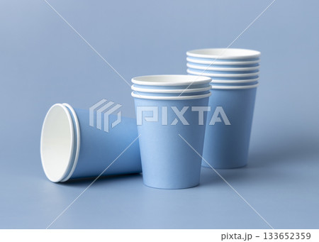 Disposable light blue paper cups closeup, mockup, copy space. No plastic biodegradable single-use Disposable light blue paper cups closeup, mockup, copy space. No plastic biodegradable single-use 133652359