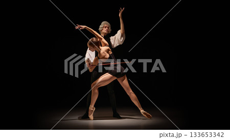 Dancer shaped into precise instrument-like line under mentor controlled guidance 133653342