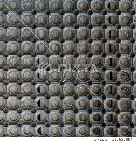 Holes rubber door mat for wiping foot with round holes texture asbtraction Holes rubber door mat for wiping foot with round holes texture asbtraction 133653894