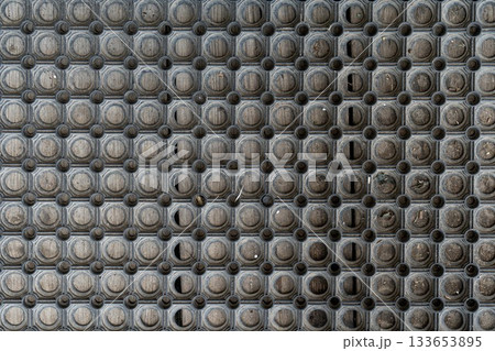 Holes rubber door mat for wiping foot with round holes texture asbtraction Holes rubber door mat for wiping foot with round holes texture asbtraction 133653895