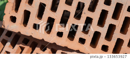 Clay red brick close-uo macro texture. Construction brick isolate on white Clay red brick close-uo macro texture. Construction brick isolate on white 133653927