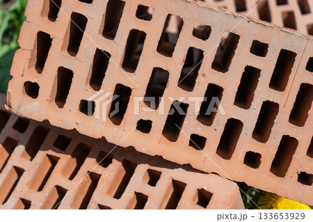 Clay red brick close-uo macro texture. Construction brick isolate on white 133653929