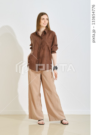 Trendy female outfit emphasizing comfort and practicality for a casual day out 133654776