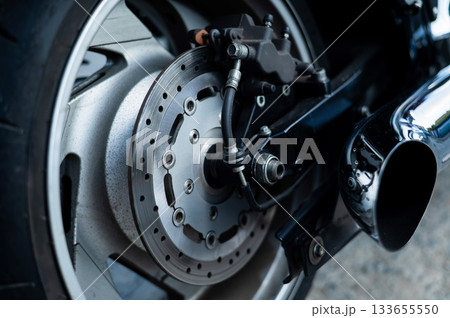 Close-up of a red motorcycle wheel.  133655550