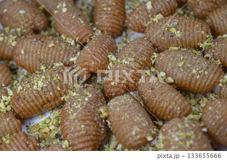 Lebanese recipe for Maakaroun fritters: fine wheat semolina, flour, butter, oil, ground anise Lebanese recipe for Maakaroun fritters: fine wheat semolina, flour, butter, oil, ground anise 133655666