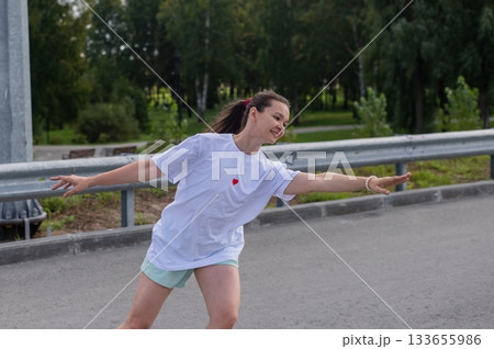 Caucasian woman in shorts roller skating. Caucasian woman in shorts roller skating. 133655986