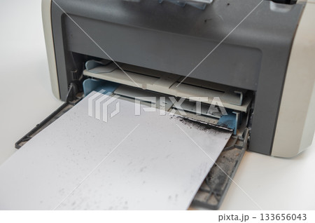 Broken laser printer cartridge on white background.  133656043