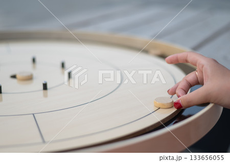 Strategic Game Pieces on a Wooden Board crokinole.  133656055