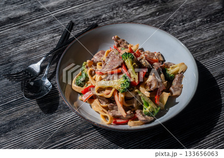 Pasta with beef, mushrooms and vegetables.  133656063