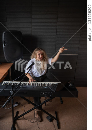Caucasian woman teaches online music lesson.. Caucasian woman teaches online music lesson.. 133656200