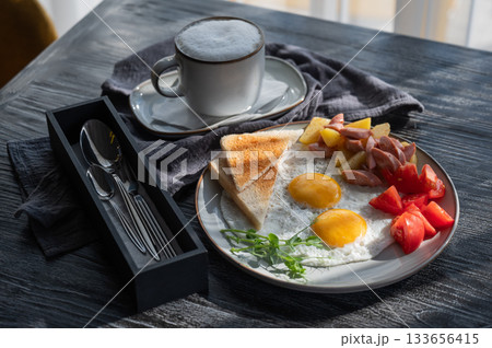 Fried eggs served in a cafe.  133656415