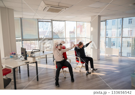 Two Caucasian men having fun at work.  133656542