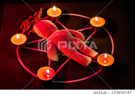 Voodoo doll on a pentagram. Witch spells. Voodoo doll on a pentagram. Witch spells. 133656547
