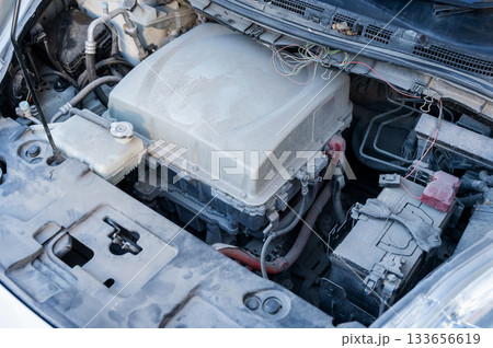 Electric motor under the hood of a car. Electric motor under the hood of a car. 133656619
