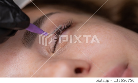 The process of professional eyelash lamination in a salon. The process of professional eyelash lamination in a salon. 133656756