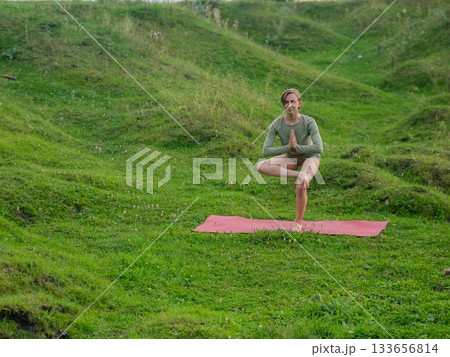 Caucasian woman doing yoga outdoors. Caucasian woman doing yoga outdoors. 133656814