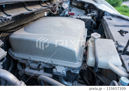 Electric motor under the hood of a car. Electric motor under the hood of a car. 133657309