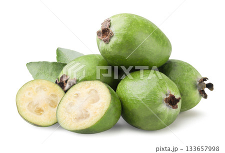 Pile of feijoa fruits and halves close-up on a white background. Isolated Pile of feijoa fruits and halves close-up on a white background. Isolated 133657998