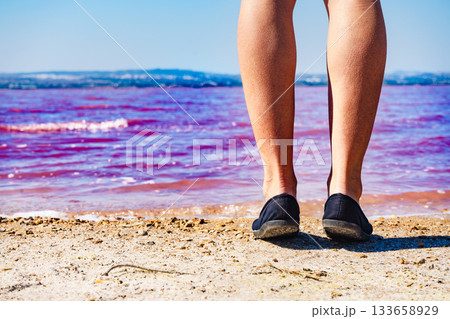 Woman on pink lake in Spain Woman on pink lake in Spain 133658929